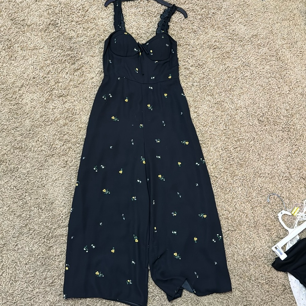 Black jumper with white and yellow flowers